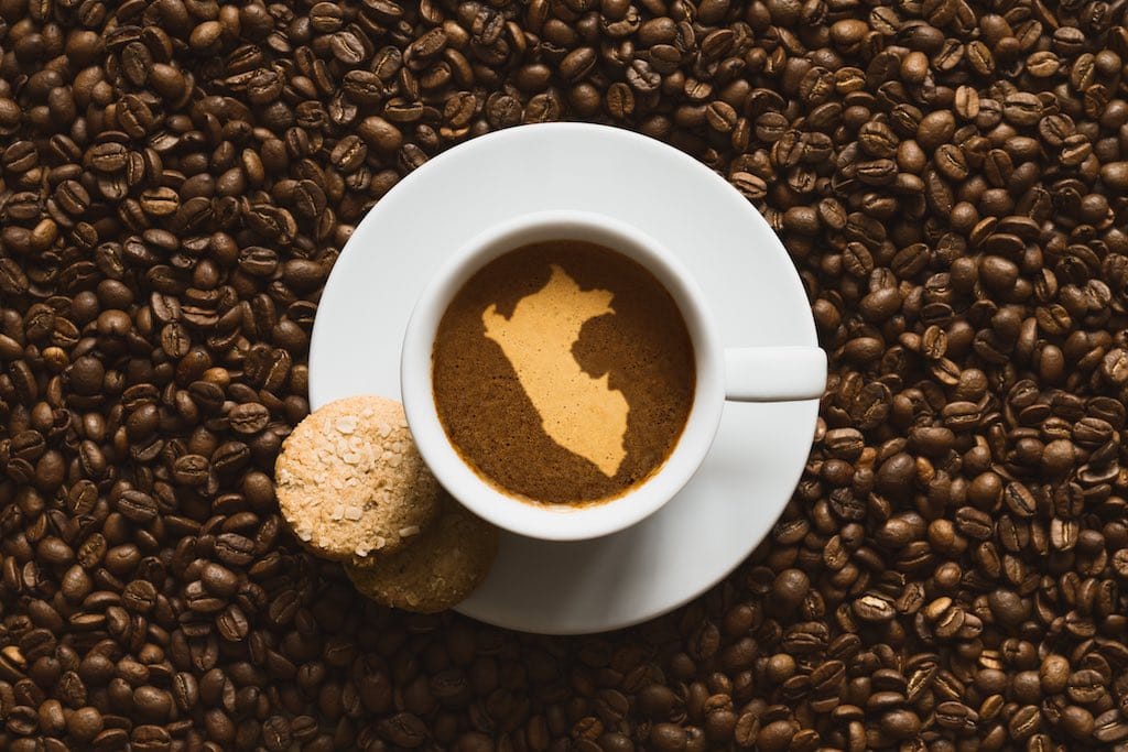 hot Peruvian coffee beverage with map of Peru
