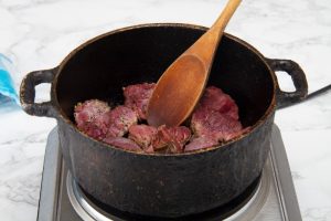 stir fry meat in deep pot