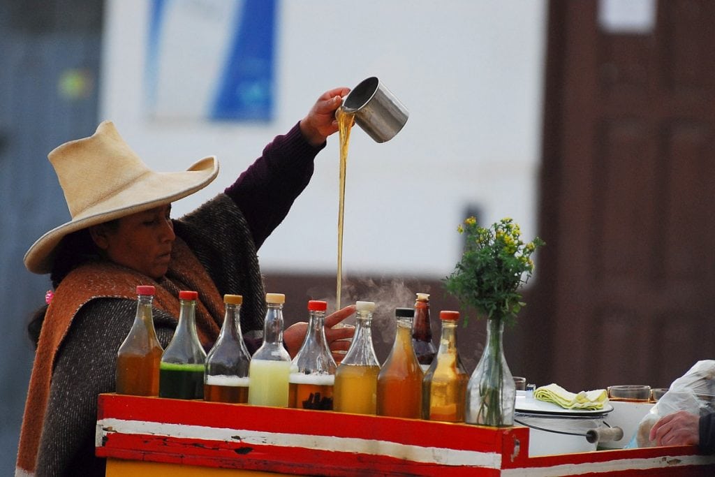 Street seller preparing emoliente