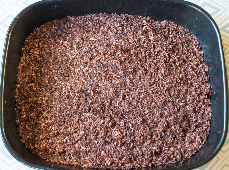 Put the chocolate cake base mixture into a flat shallow tin.