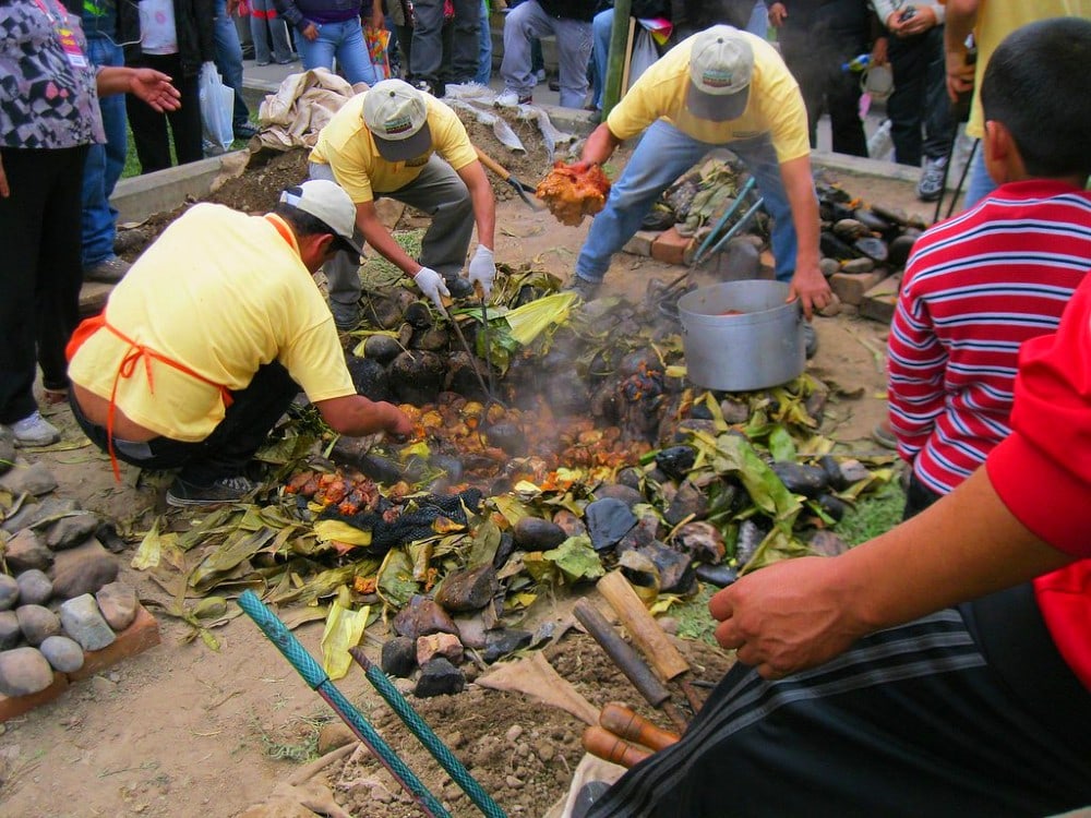 Pachamanca baking with hot stones in the ground