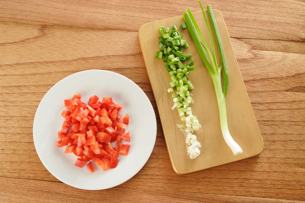 Chopped red bell peppers and spring onion ingredients