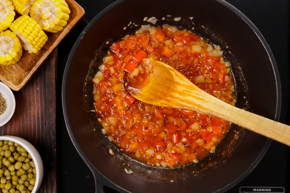 add tomato paste to pan and heat