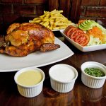 Pollo a la Brasa with salad and dipping sauces