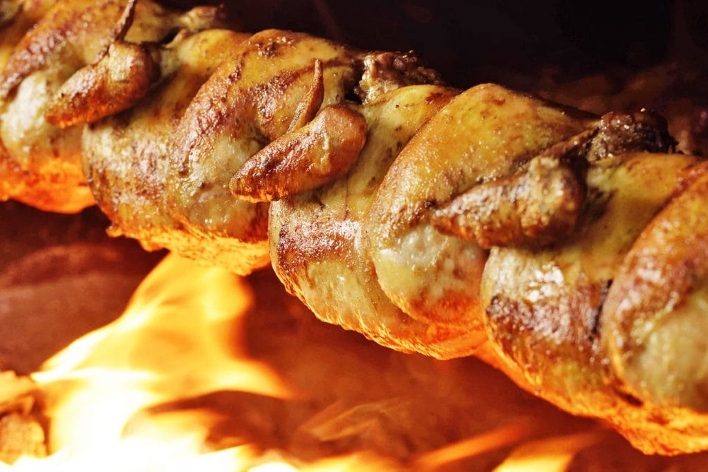 Roast chickens for pollo a la brasa
