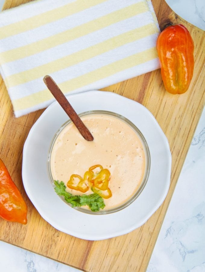 Peruvian Aji Amarillo Sauce In Bowl With Peppers