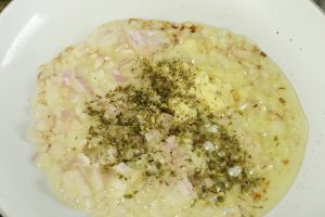 oregano added to garlic and onion