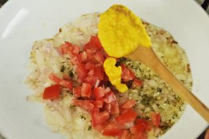 sautee with tomato and ají amarillo chili pepper