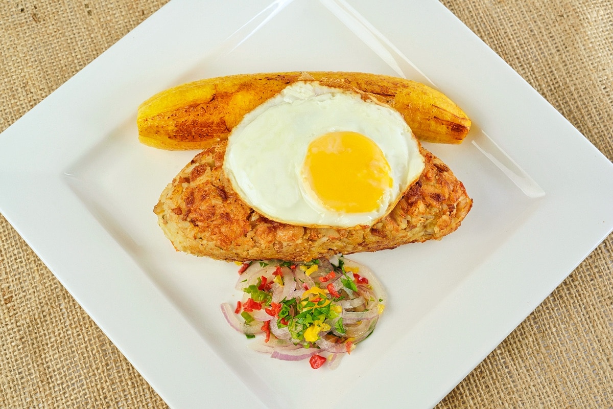 Tacu Tacu With Fried Platain Egg Salsa Criolla