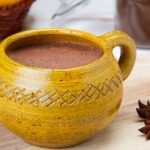 Close Up Of Milky Dark Hot Chocolate Drink With Star Anise