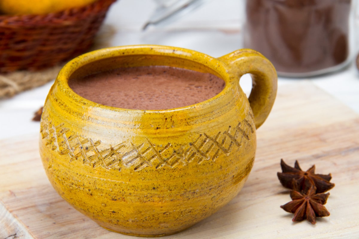 Close Up Of Milky Dark Hot Chocolate Drink With Star Anise