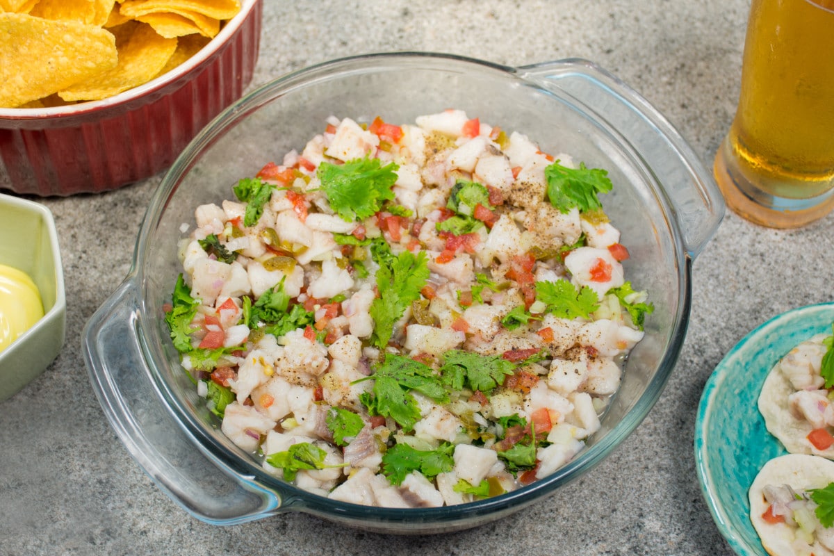 Peruvian Tilapia Cviche With Hot Sauce On Table