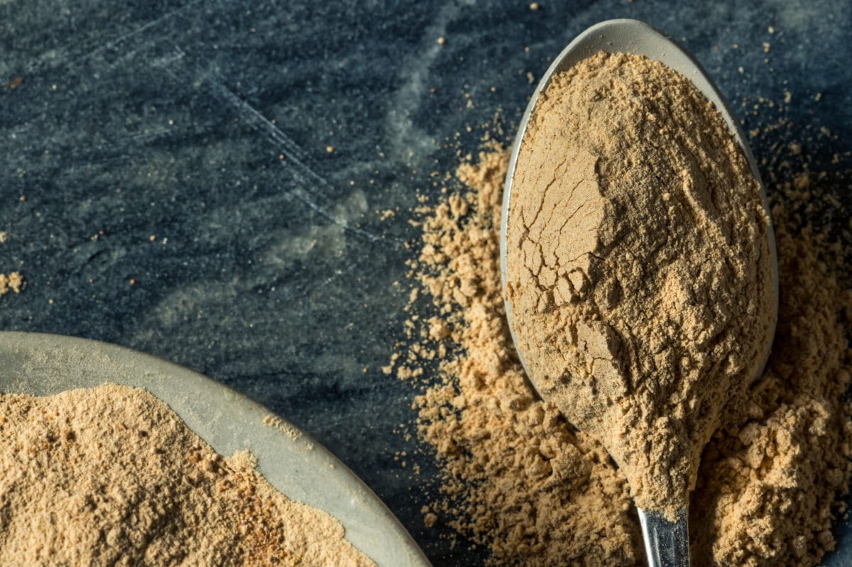 powdered maca root on spoon