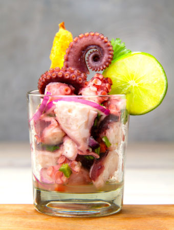 glass of pulpo ceviche with lime and platano