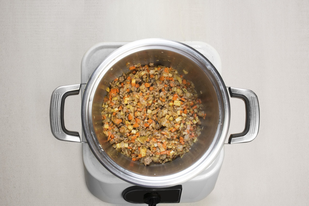 step 5 add beef and oregano to simmer in pot