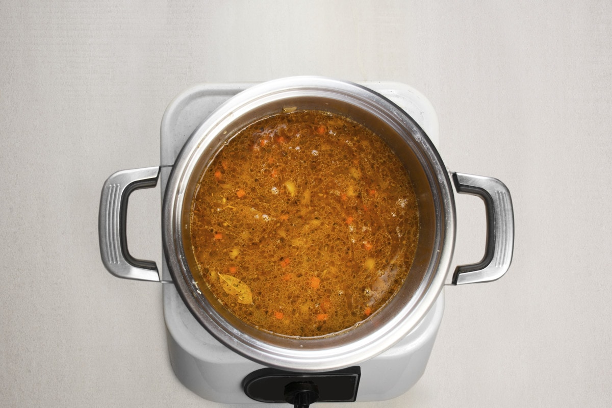 step 6 add tomato paste and beef broth