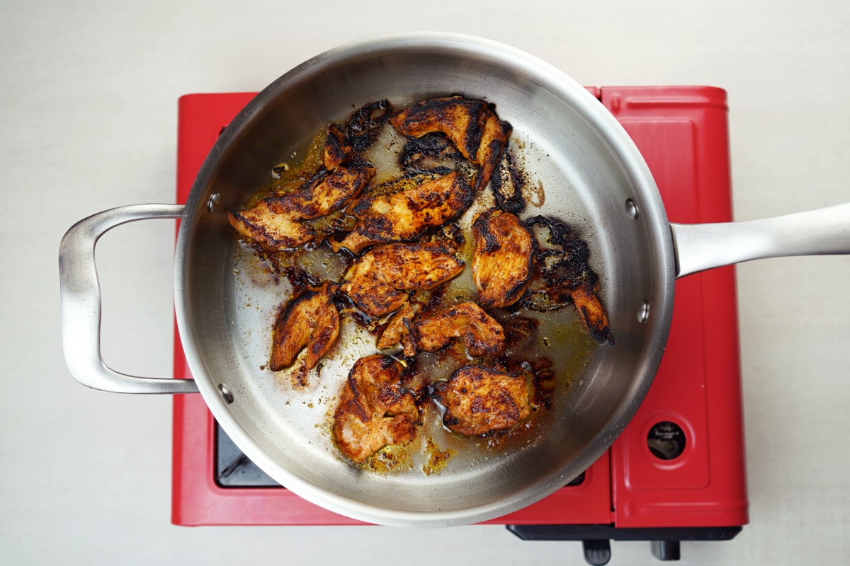 step 4 sear pieces of chicken breast on pan