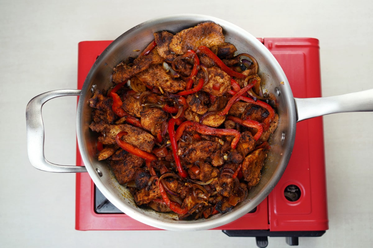 step 6 add bell peppers to pieces of chicken breast