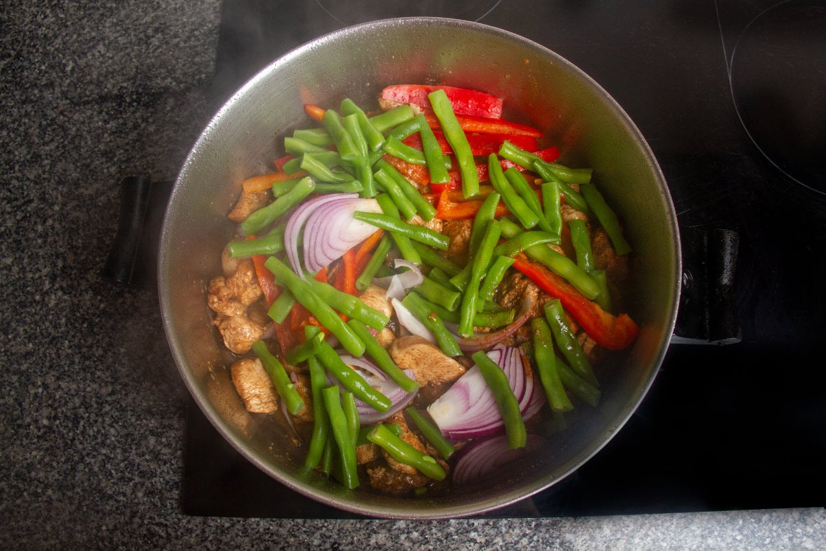 step 7 add beans peppers onions