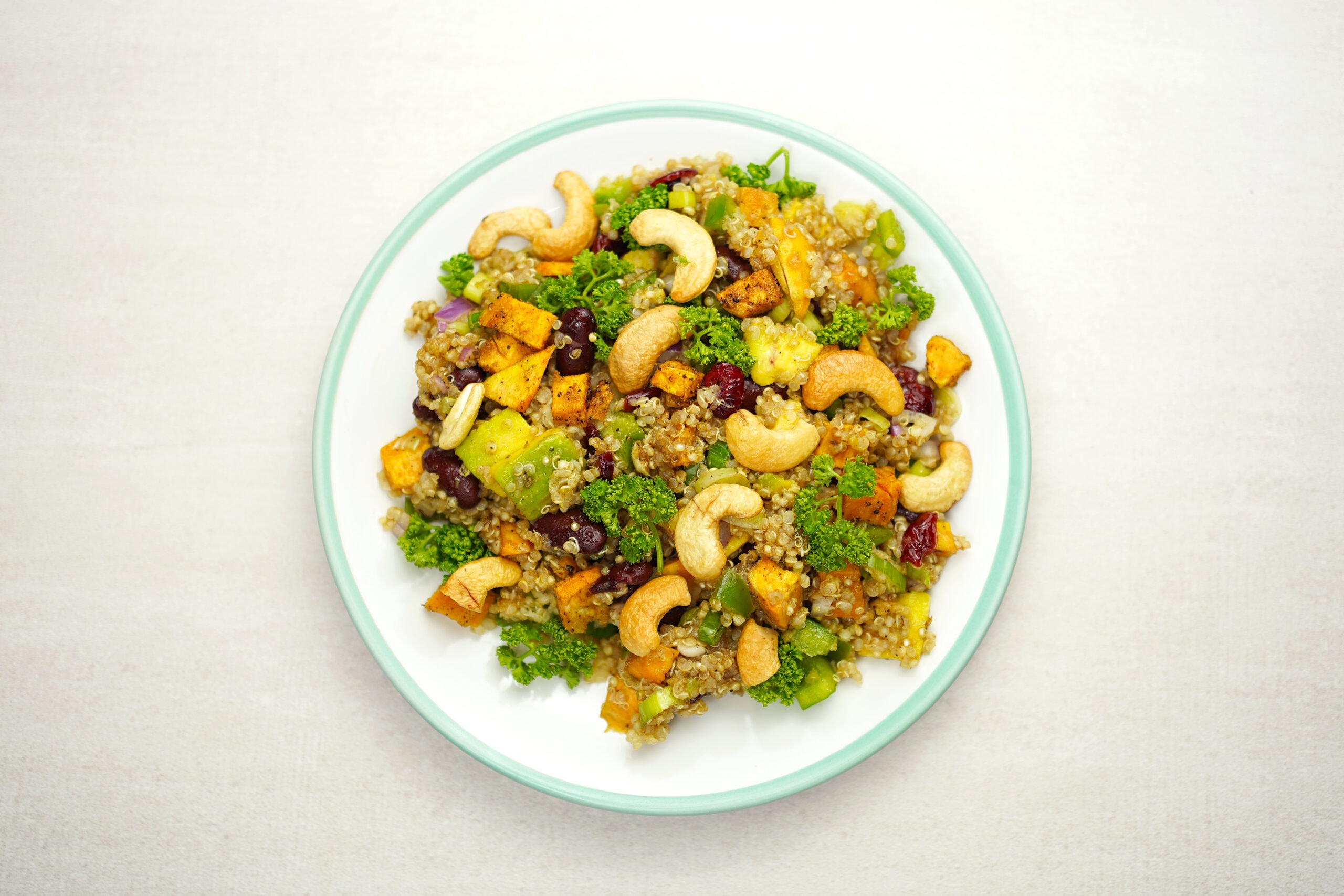 Quinoa salad with vegetables and cashews.